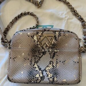 Kelly Wynne Crossbody Mingle Mingle Mini in metallic snakeskin leather